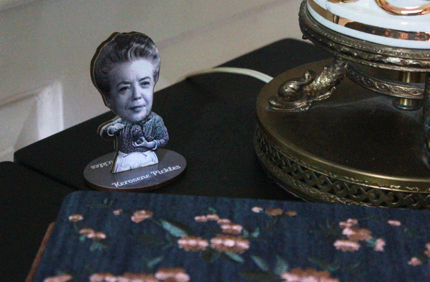 A bobblehead figure of ‘Andy Griffith Show’  character Aunt Bee sits on the side table of the house formarly owned by actress Frances Bavier in Siler City.
